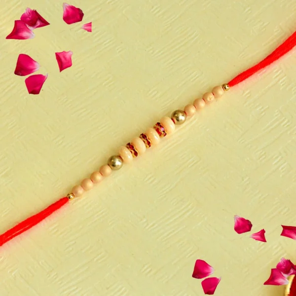 Classic Elegance Rakhi – RK-126 | Beige Beads with Gold Highlights on Red Thread - Image 1