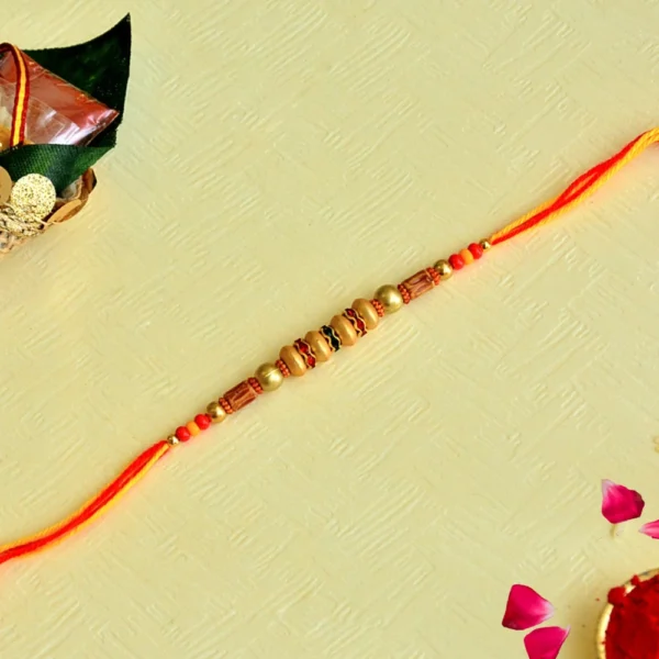 Festive Elegance Rakhi – RK-128 | Bright Orange Thread with Ornate Beads - Image 1
