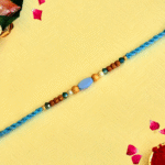 Tranquil Blue Rakhi – RK-131 | Sky Thread with Oval Bead & Wooden Accents
