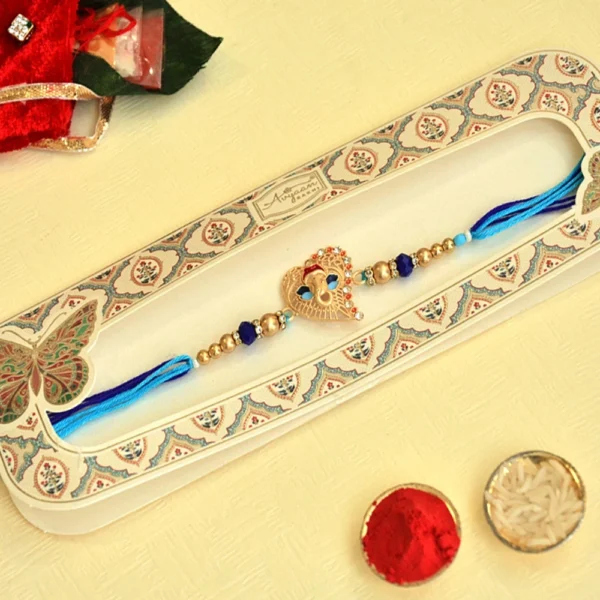 Elegant Ganesh Motif Rakhi - RK-36 | Blue Thread & Beaded Design