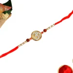 Spiritual Om Rakhi – RK-117 | Red Thread with Rudraksha & Pearl Beads - Image 3