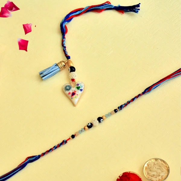 Designer Bhaiya Bhabhi Rakhi Set – RK-135 | Blue-Red Thread with Heart Charm & Beaded Bracelet - Image 1