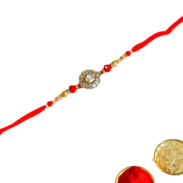 Crystal Bloom Rakhi – RK-118 | Red Thread with Floral Zircon Center & Gold Bead Detailing - Image 3