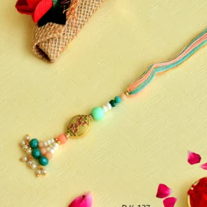 Elegant Floral Lumba Rakhi – RK-137 | Pastel Green & Peach Beads with Pearl Tassels for Bhabhi