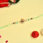 Peacock Theme Rakhi - RK-40 | Elegant Mint Green Thread with Beads & Crystal Accents - Image 2