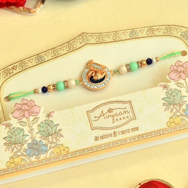 Peacock Theme Rakhi - RK-40 | Elegant Mint Green Thread with Beads & Crystal Accents - Image 1