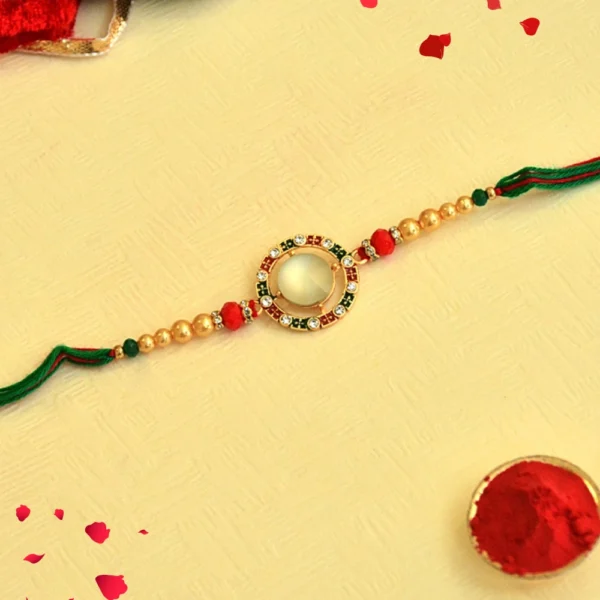 Regal Radiance Rakhi – RK-41 | Circular Kundan Dial with Pearl & Thread Detailing - Image 1
