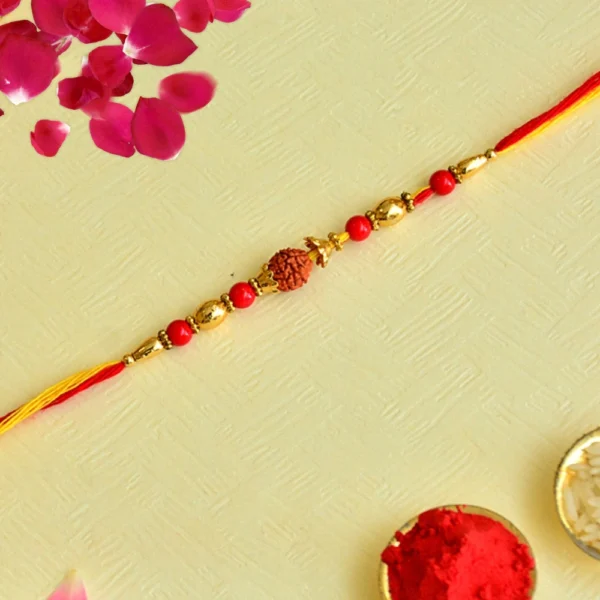 Elegant Rudraksha Rakhi – RK-143 | Gold-Toned Beads & Red Accents for a Sacred Bond - Image 1