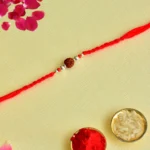 Classic Rudraksha Rakhi – RK-145 | Simple Red Thread with Spiritual Essence