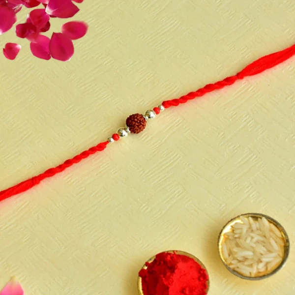 Classic Rudraksha Rakhi – RK-145 | Simple Red Thread with Spiritual Essence - Image 1