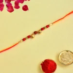 Traditional Rudraksha Bell Rakhi – RK-147 | Festive Charm with Sacred Elegance