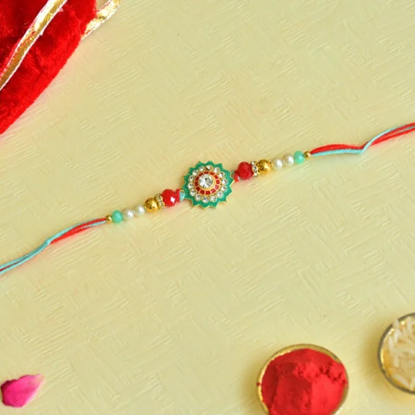 Traditional Floral Rakhi – RK-53 | Red-Blue Thread with Mirror Work & Gold Beads - Image 1