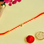 Elegant Red & Yellow Rakhi - RK-149 with Single Gold Bead