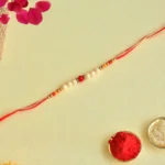 Pearl Bead Rakhi – RK-152 Red Center Stone