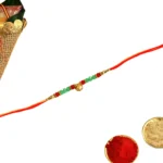 Golden Beaded Rakhi – RK-146 | Red & Green Elegance with Blessings - Image 3