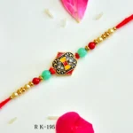 Regal Shield Rakhi – RK-195 | Elegant Rakhi with Royal Enamel Design & Sparkling Crystal Accents