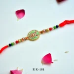 Peacock Grace Rakhi – RK-184 | Elegant Enamel Rakhi with Colorful Beads & Crystal Accents for Brother