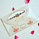 Regal Blossom Rakhi – RK-186 | Elegant Floral Rakhi with Stone Studded Center & Multicolor Beads for Brother - Image 2