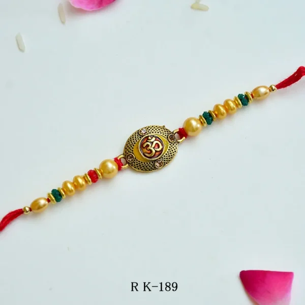 Divine Om Rakhi – RK-189 | Traditional Rakhi with Golden Beads & Sacred Om Emblem - Image 1