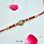 Peacock Elegance Rakhi – RK-197 | Peacock Feather Motif & Crystal Embellishments