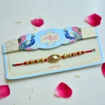Royal Touch Rakhi – RK-198 | Gold Oval Designer Rakhi with Embedded Crystal & Intricate Detailing - Image 2