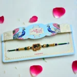 Peacock Grace Rakhi – RK-199 | "Shree Krishna" Script & Peacock Feather Design in Antique Gold Frame - Image 2