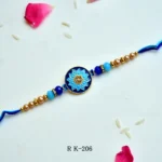 Royal Blue Lotus Mandala Rakhi – RK-206 | Meenakari Round Dial Rakhi with Crystal Accents