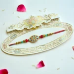Royal Shield Rakhi – RK-208 | Elegant Rakhi with Red & Blue Enamel Centre and Golden Beads - Image 2
