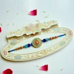 Azure Charm Rakhi – RK-209 | Premium Blue & Gold Circular Rakhi with Crystal Accents - Image 2
