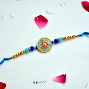 Azure Charm Rakhi – RK-209 | Premium Blue & Gold Circular Rakhi with Crystal Accents