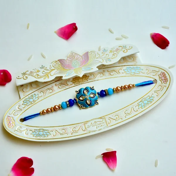 Cerulean Blossom Rakhi – RK-210 | Elegant Floral Blue Rakhi with Beads & Crystals - Image 2