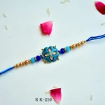 Cerulean Blossom Rakhi – RK-210 | Elegant Floral Blue Rakhi with Beads & Crystals