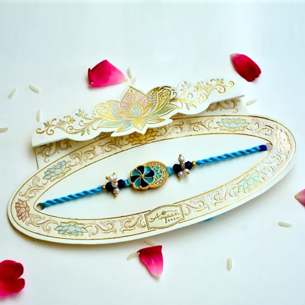 Azure Petal Rakhi – RK-211 | Charming Blue Floral Rakhi with Pearl Clusters & Beaded Thread - Image 2