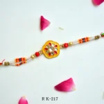 Vibrant Kundan Floral Rakhi – RK-217 | Traditional Rakhi with Beads & Multicolor Threads