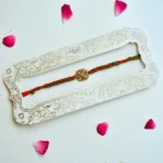 Swastik Traditional Rakhi – RK-224 | Handcrafted Rakhi with Red-Green Braided Thread - Image 2