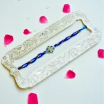 Ocean Bloom Rakhi – RK-228 | Blue Thread Rakhi with Floral Enamel & Crystal Detailing - Image 2