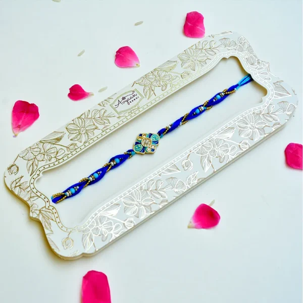 Ocean Bloom Rakhi – RK-228 | Blue Thread Rakhi with Floral Enamel & Crystal Detailing - Image 2