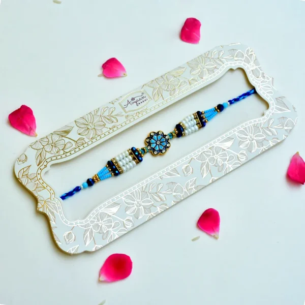 Royal Azure Pearl Rakhi – RK-229 | Floral Centerpiece with White Pearls & Blue Crystal Beads - Image 2
