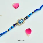 Blue Evil Eye Rakhi – RK-236 | Protective Glass Bead Rakhi with Luxe Golden Frame & Blue Thread