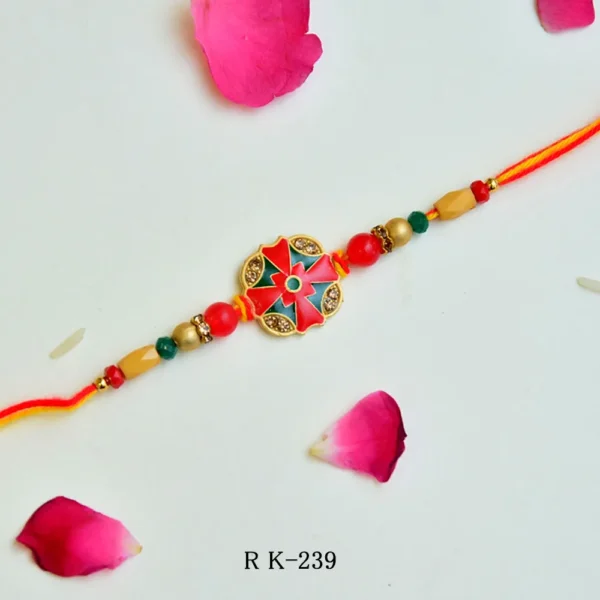 Elegant Floral Motif Rakhi – RK-239 | Red & Green Enamel Centerpiece with Golden Beads & Dual Tone Thread - Image 1