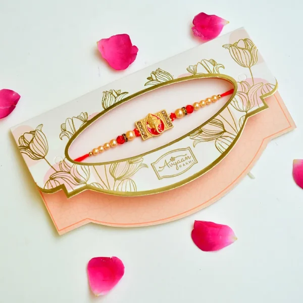 Divine Ganesha Rakhi – RK-240 | Golden Ganesha Center with Pearl Beads & Red Accents - Image 2
