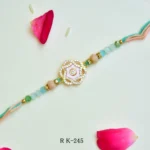 Pastel Peach & Green Stone Rakhi – RK-245 | Elegant Floral Design with Diamond Centerpiece