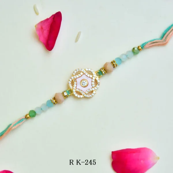 Pastel Peach & Green Stone Rakhi – RK-245 | Elegant Floral Design with Diamond Centerpiece - Image 1