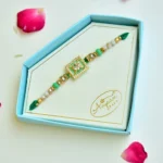 Elegant Green Crystal Elephant Rakhi – RK-247 | Golden Beaded Design with Sparkling Frame - Image 2