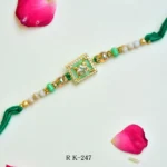 Elegant Green Crystal Elephant Rakhi – RK-247 | Golden Beaded Design with Sparkling Frame