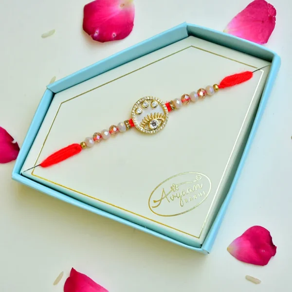 Eye Motif Designer Rakhi – RK-248 | Red Thread with Crystal Beads and Gold Accents - Image 2