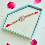 Elegant Floral Stone Rakhi – RK-249 | Red Thread with Gold & Crystal Beads - Image 2