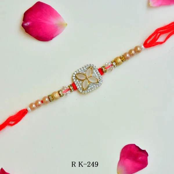 Elegant Floral Stone Rakhi – RK-249 | Red Thread with Gold & Crystal Beads - Image 1