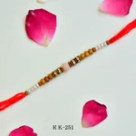 RK-251 | Elegant Wooden & Pearl Beads Rakhi with Soft Pink Centerpiece (Set of 12)