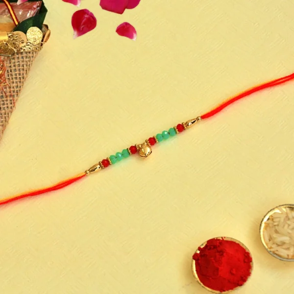 Golden Beaded Rakhi – RK-146 | Red & Green Elegance with Blessings